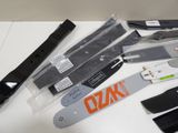 many different types of knives on a white table