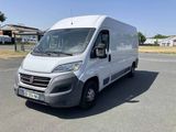a white van that is parked in the parking lot
