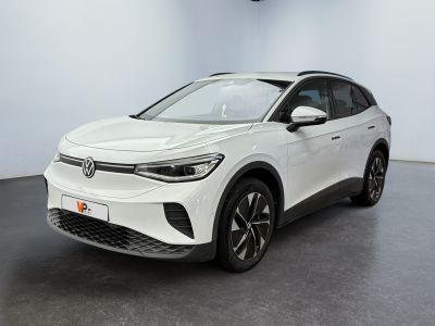 a white volkswagen suv parked in a showroom