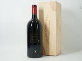 a bottle of wine sitting next to a wooden box