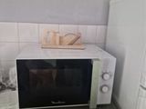 a microwave that is sitting on a counter in a kitchen