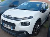 a picture of a white citrole parked on the side of the road