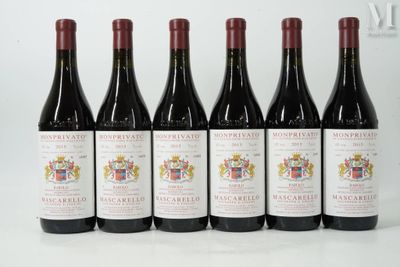 six bottles of red wine are lined up on a table