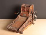 a wooden machine that is sitting on a table