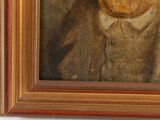 portrait of a man in a suit and tie in a gold frame