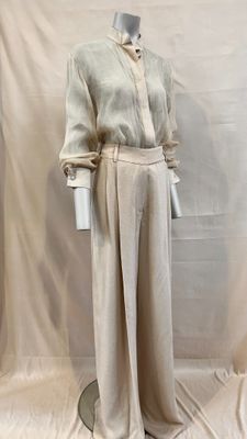 an image of a mannequin wearing a white shirt and pants