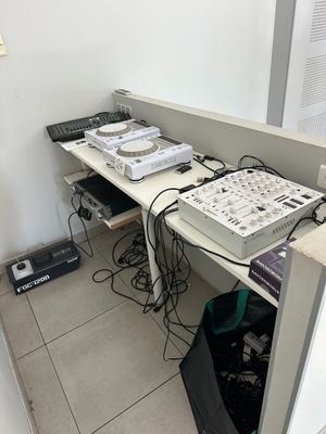 a picture of a computer desk with a lot of electronics on it
