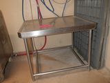 a stainless steel table in the middle of a room