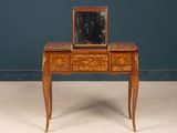 an antique wooden desk with a mirror on top of it