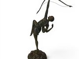 bronze sculpture of a woman holding a bow and arrow