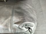 a close up of a purse on the floor