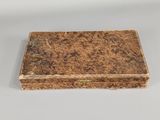 an image of a small box with a lid on a table