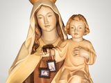 statue of the virgin mary holding a child in her arms