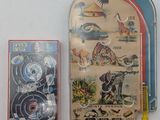two tins that are sitting next to each other on a table