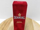a small red box on top of a wooden table