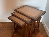 three tables that are sitting on a hard wood floor