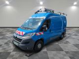 an image of a blue van parked in a room