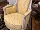 a chair that is sitting on a rug in a room