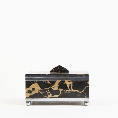 black and gold marble box with a black lid