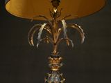 a lamp that is sitting on a table with a lamp shade on it