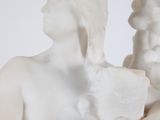 a statue of a woman holding a baby in her arms