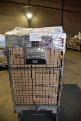 a cart that has many boxes on it in a warehouse