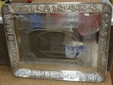 a picture of a silver tray with a picture in it