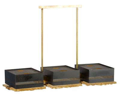 three boxes that are sitting on a wooden stand