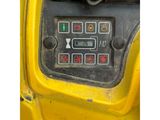 a close up of a control panel on a yellow vehicle