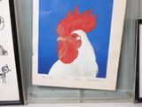 a picture of a rooster with a red comb on it ' s head and a picture of a rooster with a red comb on it ' s head