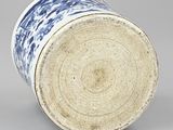 a blue and white vase sitting on a table