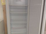 an image of an empty refrigerator in a kitchen