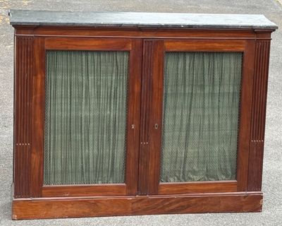 a wooden cabinet with two glass doors and a marble top