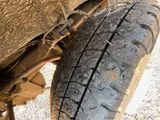 a close up view of a tire on a vehicle