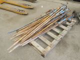 a pile of old skis and ski poles on a pallet