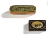 two small tins with a picture of a man and a woman on them