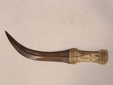 a very long horn shaped object on a white surface