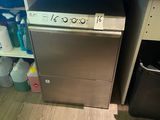a small kitchen with a stove, dishwasher, and a microwave