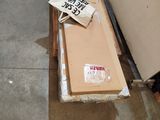 a cardboard box on the floor next to a cardboard box on the floor
