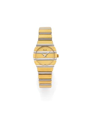 a lady ' s wrist watch with two tone stainless steel and yellow gold