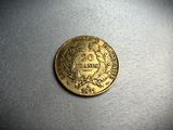 a close up of a gold coin on a table