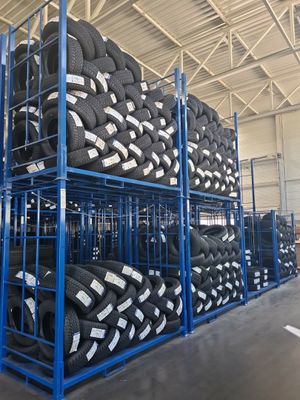 many tires stacked on a rack in a warehouse