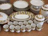 many plates, cups, cups, and saucers on the table