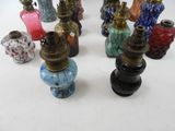 a lot of different colored glass vases on the table
