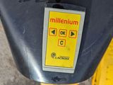 a close up of a parking meter with a yellow sticker on it