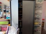 an image of a room with a refrigerator and a table