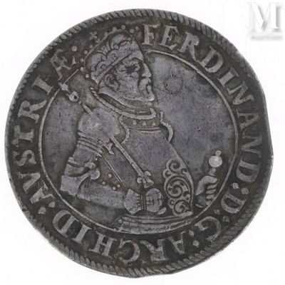 an old silver coin with a man holding a sword on it