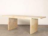 an image of a wooden table in a white room