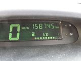 a close up of a digital clock on the dashboard of a car