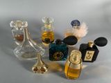 a lot of perfume bottles that are sitting on a table